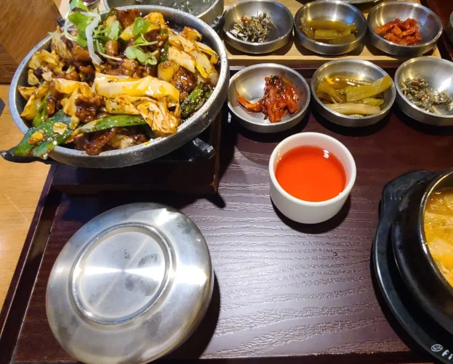 Grilled pork set served on a tabletop grill