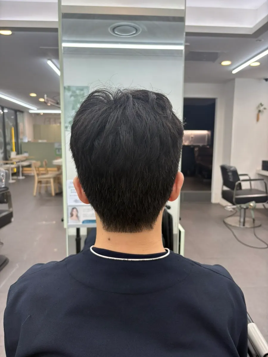 Front view of the finished men's perm style