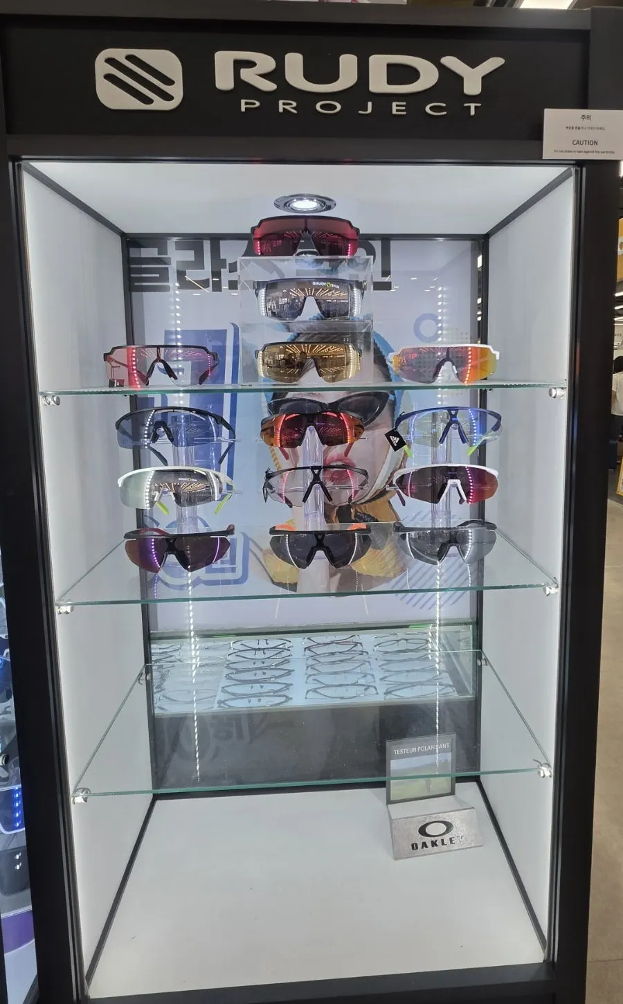 Sunglasses arranged by brand inside the store