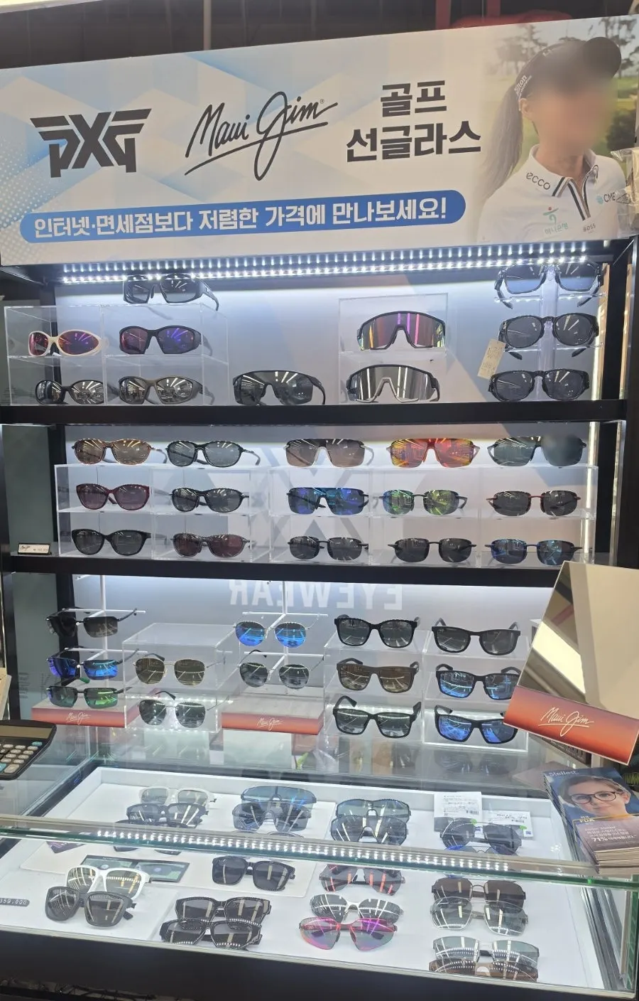 Display case holding Oakley goggles