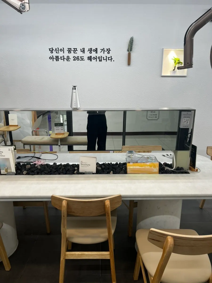 Long, narrow treatment space inside the salon