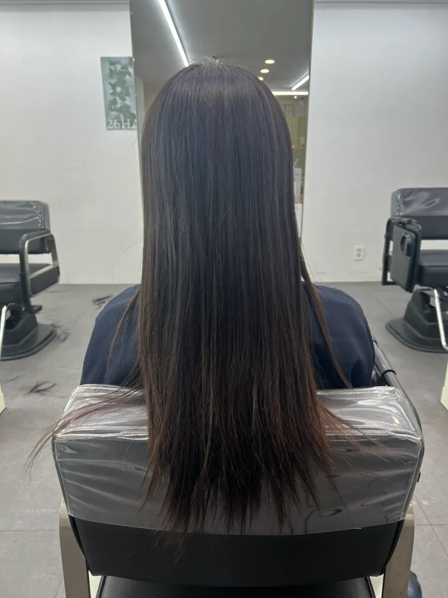 Damaged hair with unruly, flyaway ends before treatment