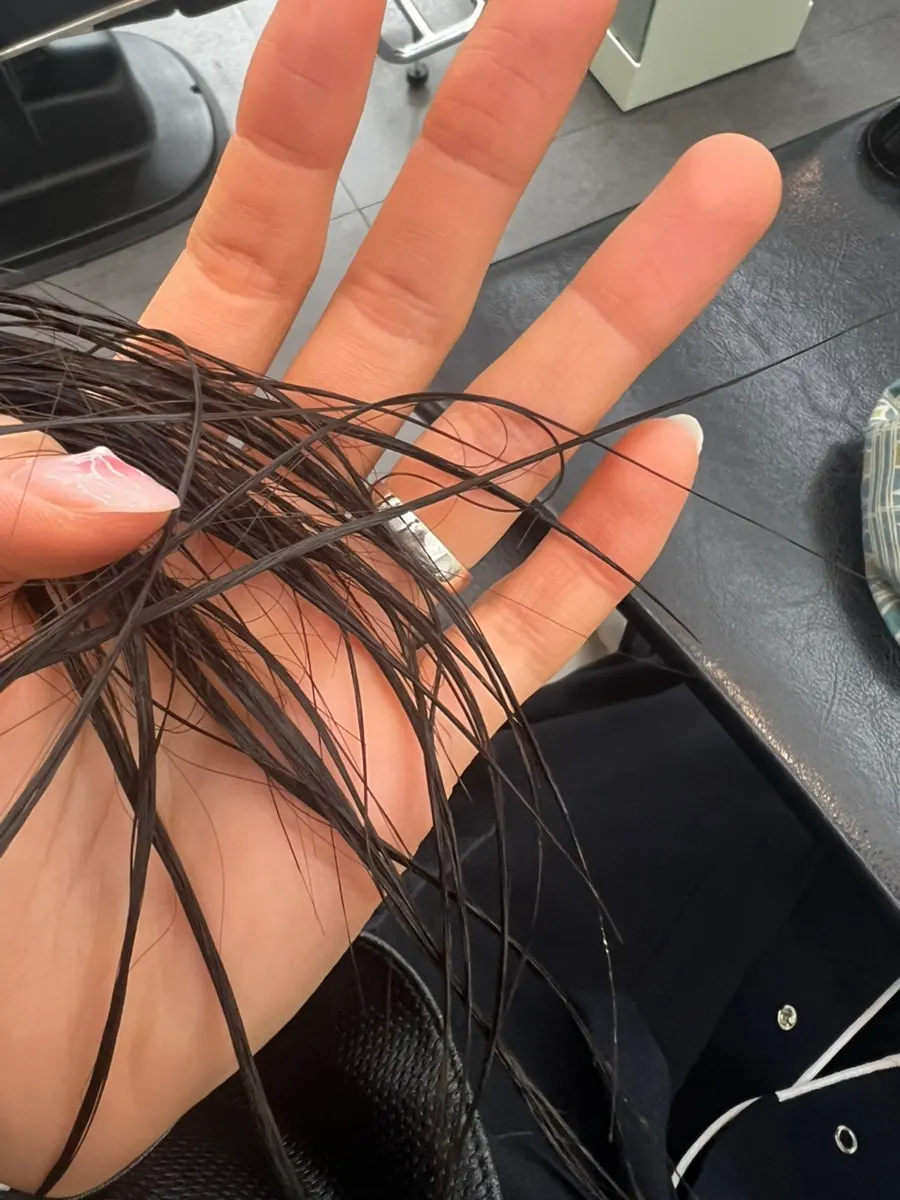 Checking hair condition after applying test product