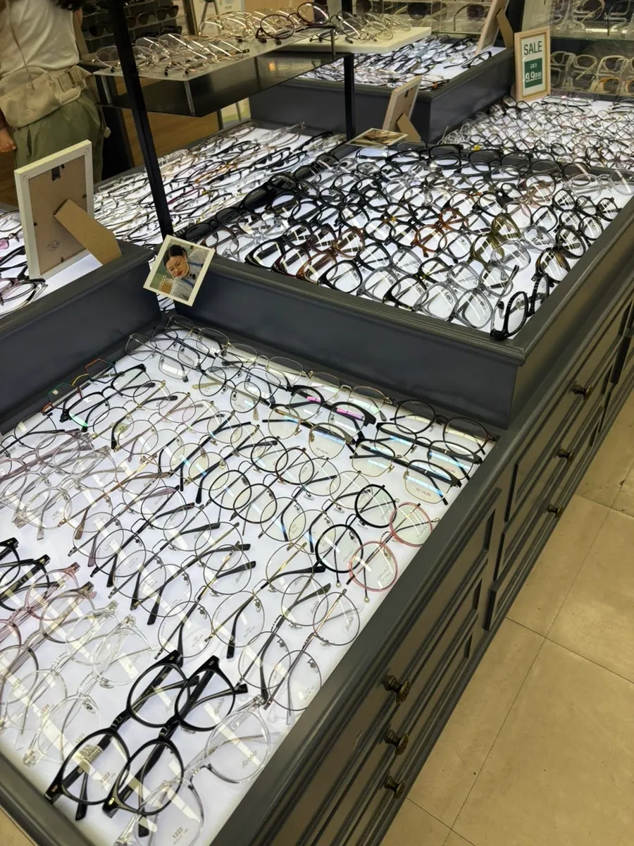 Glasses and sunglasses displayed side by side