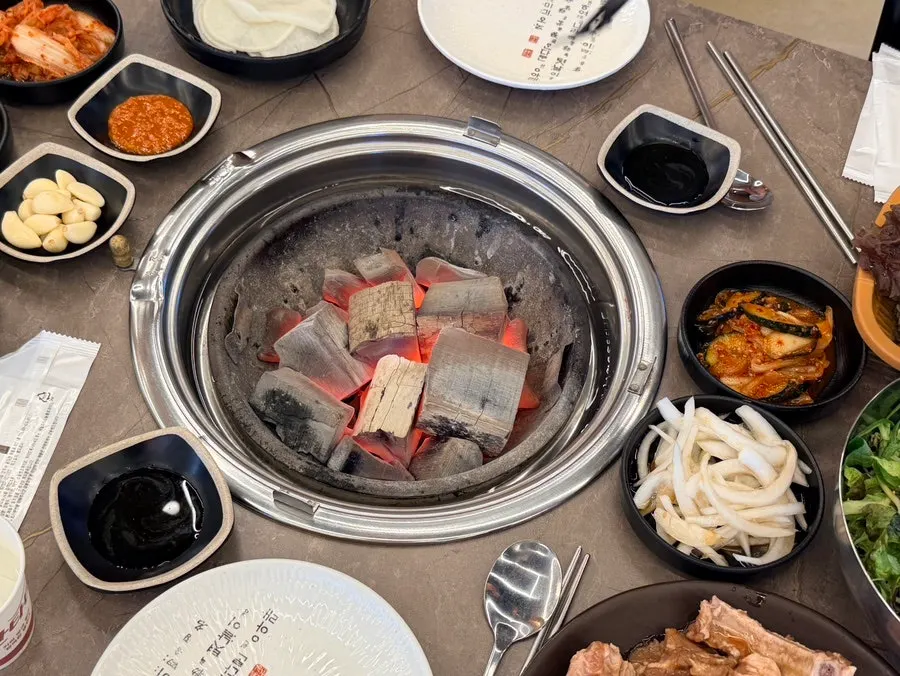 Marinated galbi placed over charcoal