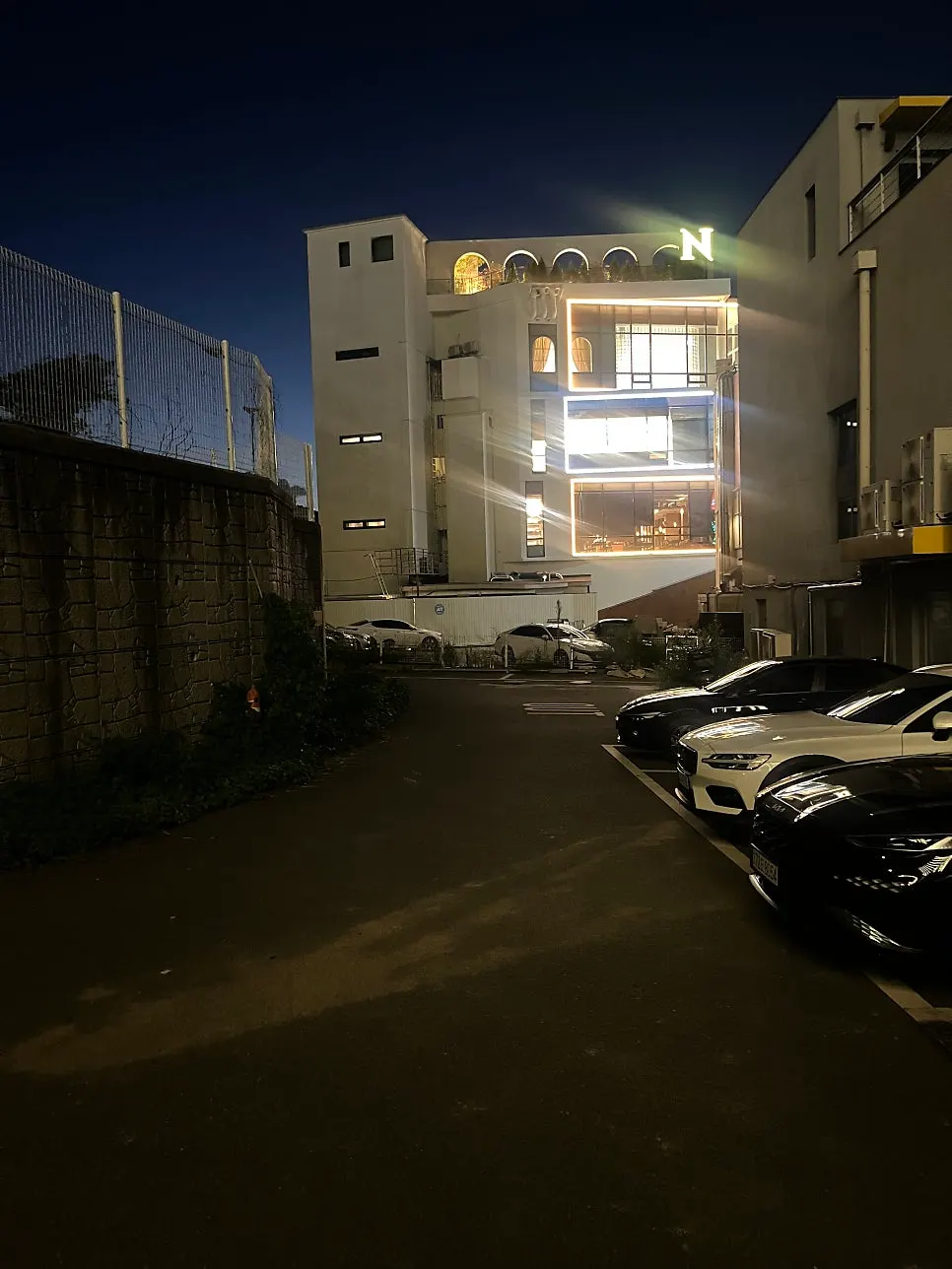 Building's own parking space and lit-up signage