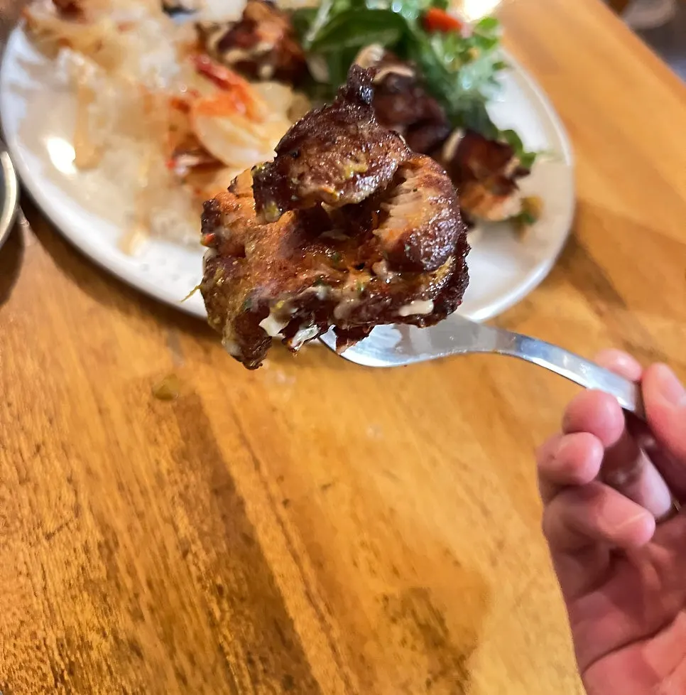 Tandoori tikka salad and rice drizzled with dressing