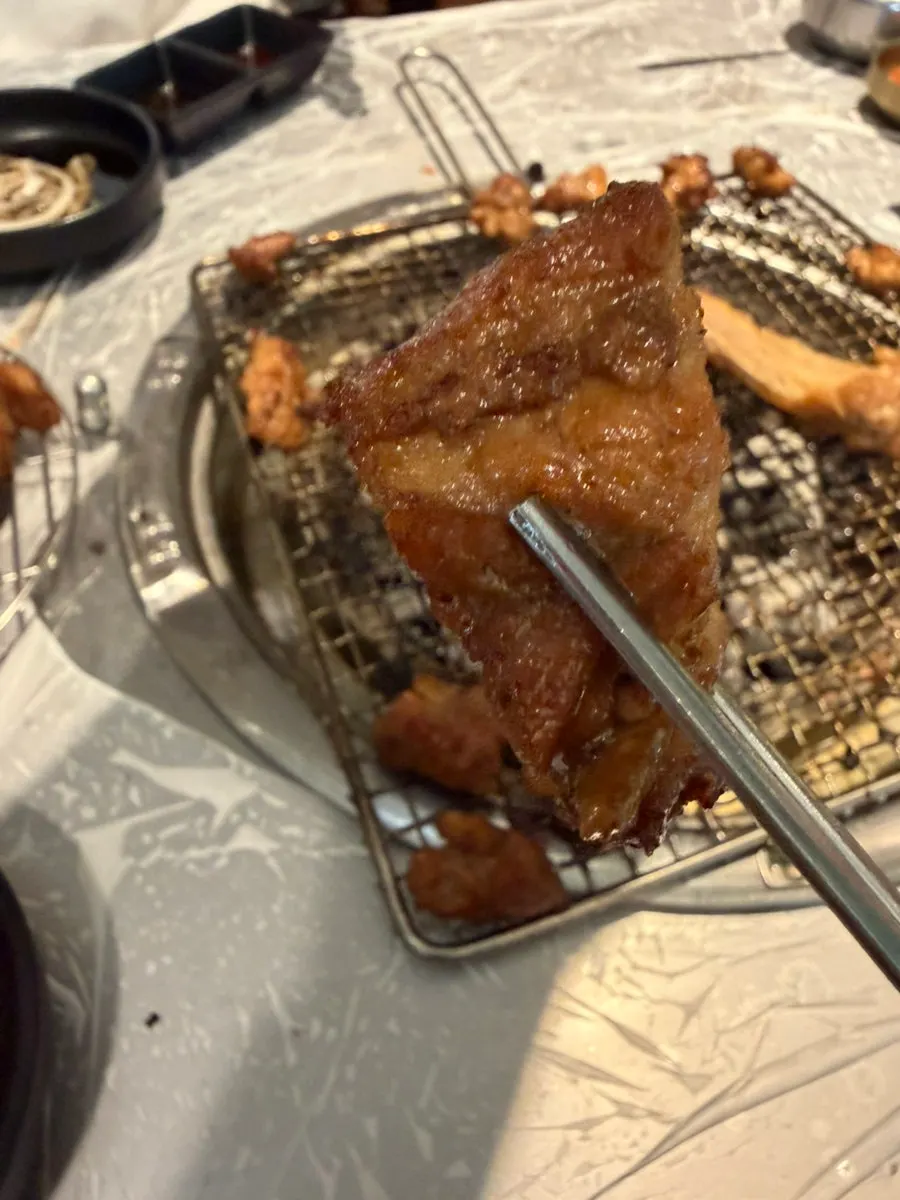 Close-up of glossy charcoal-grilled pork galbi