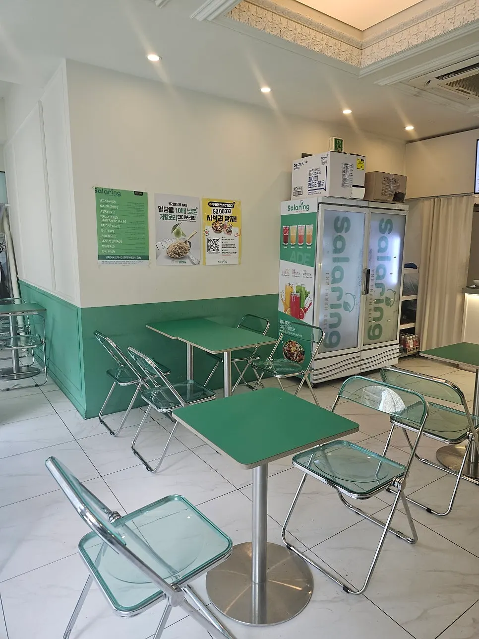 Shop seating with green tables