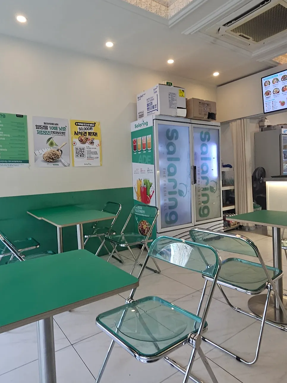 Shop seating with green tables