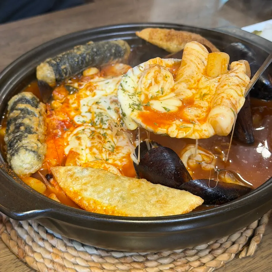 Joseon Chicken and tteokbokki together on the table