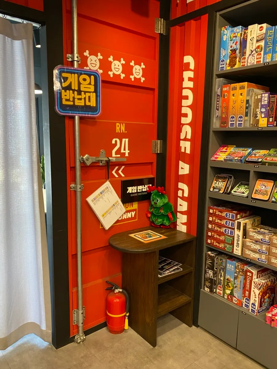 Self-serve area with board game supplies and blankets