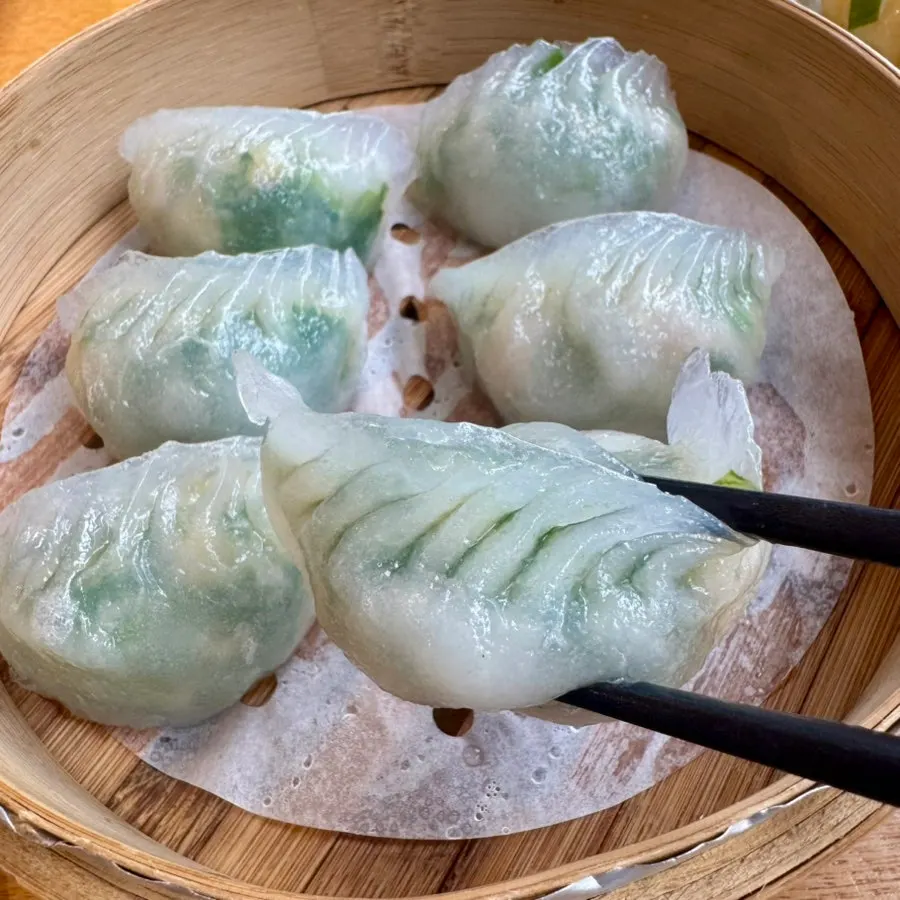 Green filling visible through the semi-translucent dumpling wrapper