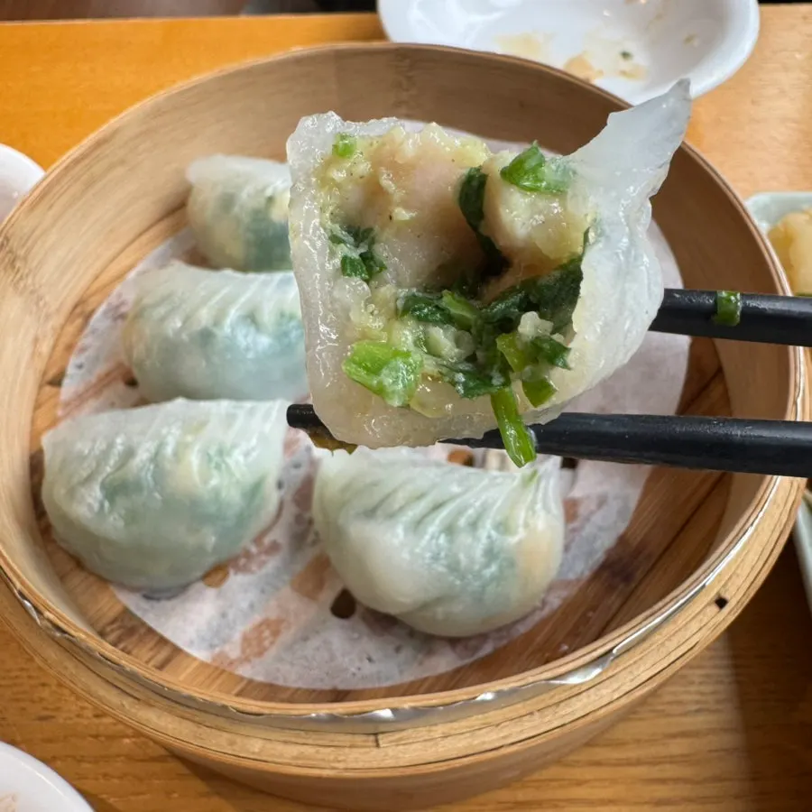 A bite of dumpling filled with shrimp and chives
