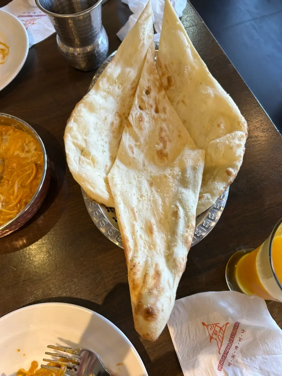 Warm cheese naan paired with curry