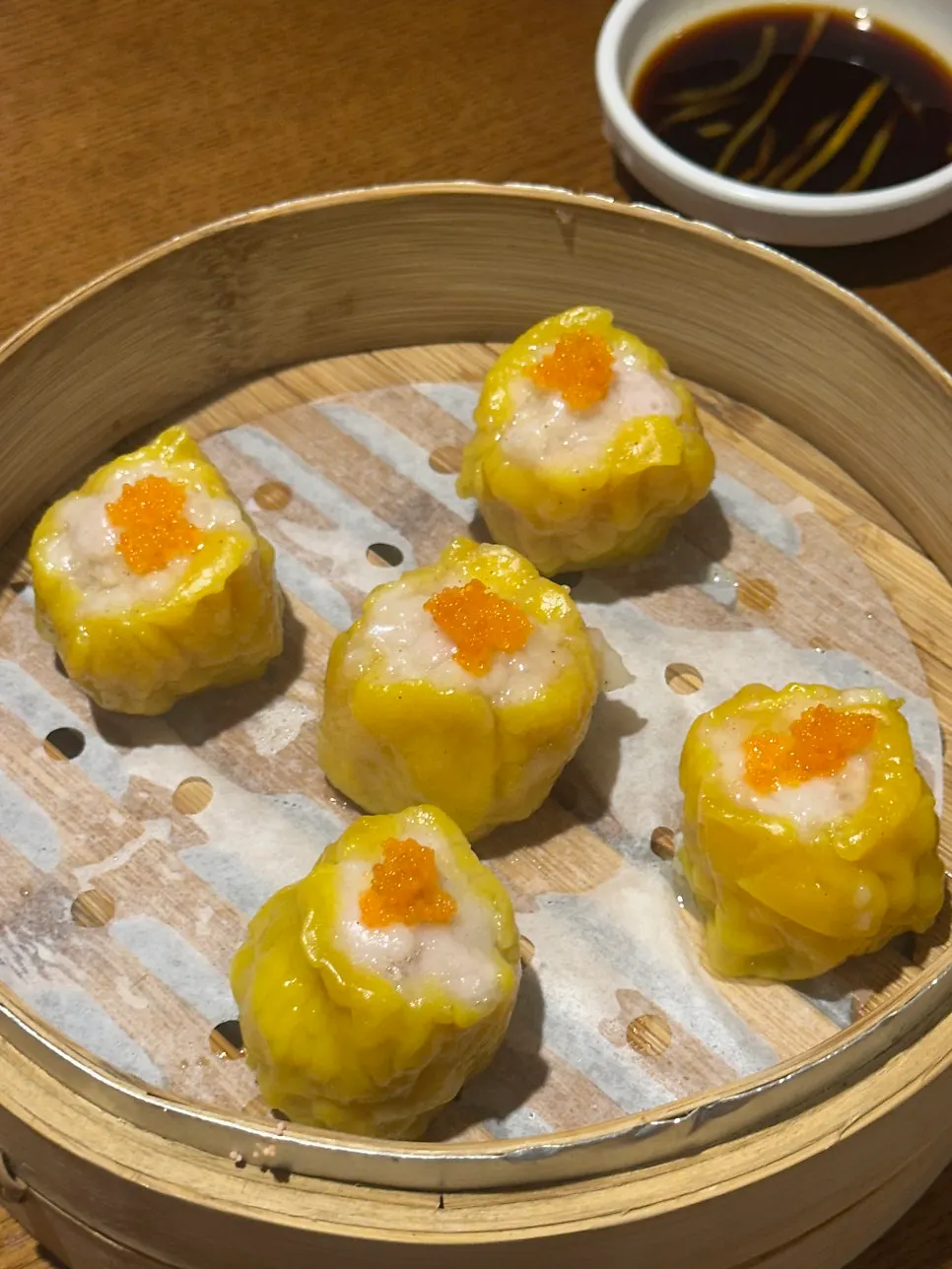 Close-up of xiaolongbao in the steamer basket