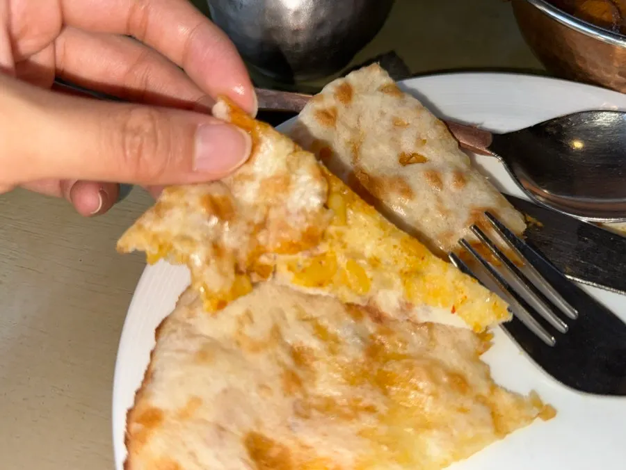 Cross-section of aloo paratha filled with vegetables