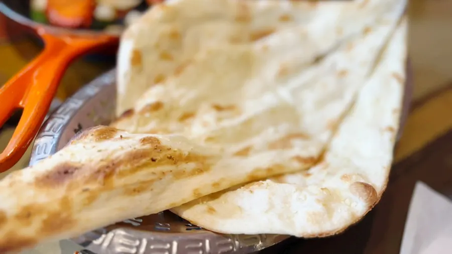 Large butter naan and garlic naan fresh off the grill