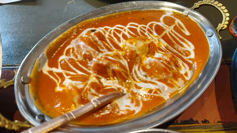 A bowl of creamy prawn makhani curry