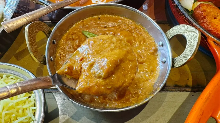 Tomato-based chicken masala curry