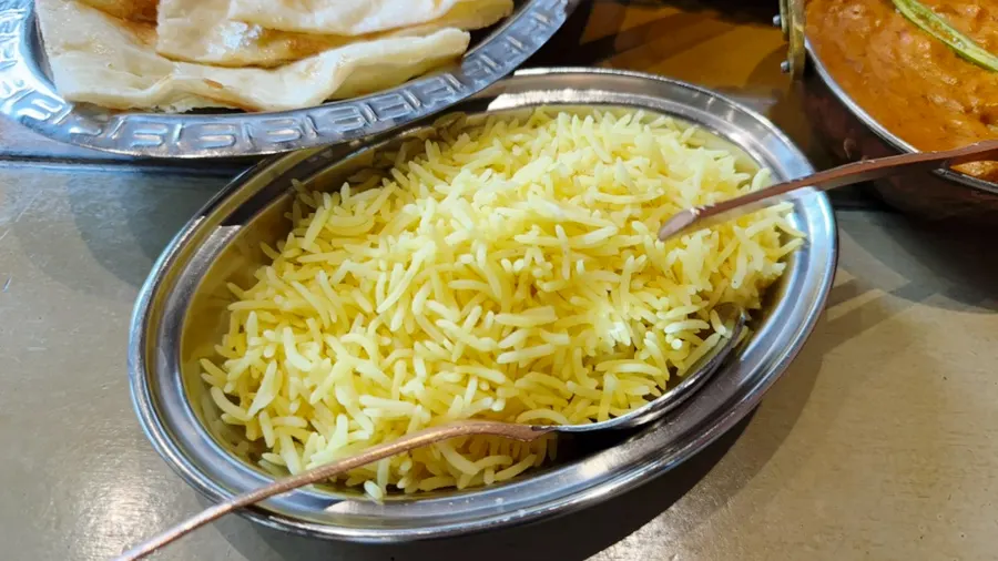 Plate of chicken masala served with naan