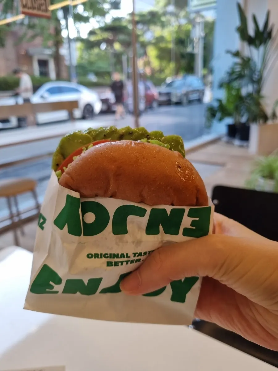 Table with burgers and fries enjoyed together