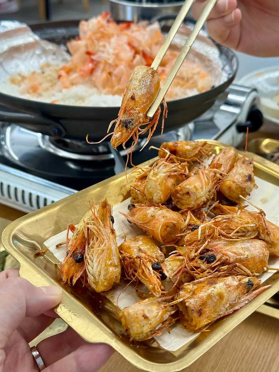 Grilled shrimp heads topped with salted butter