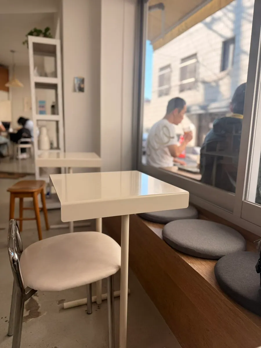 Café interior busy with customers on a weekday afternoon