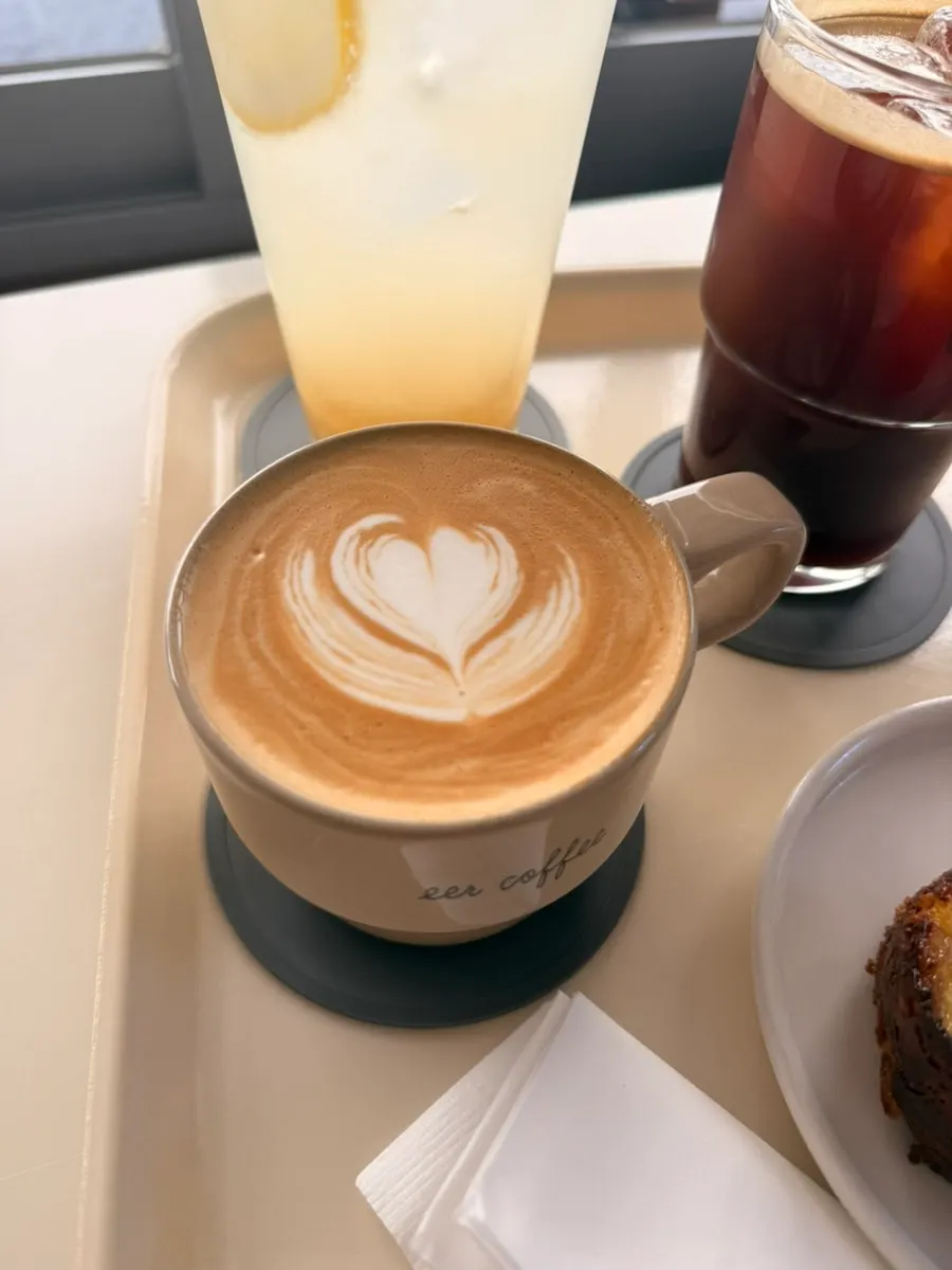 Almond latte topped with latte art