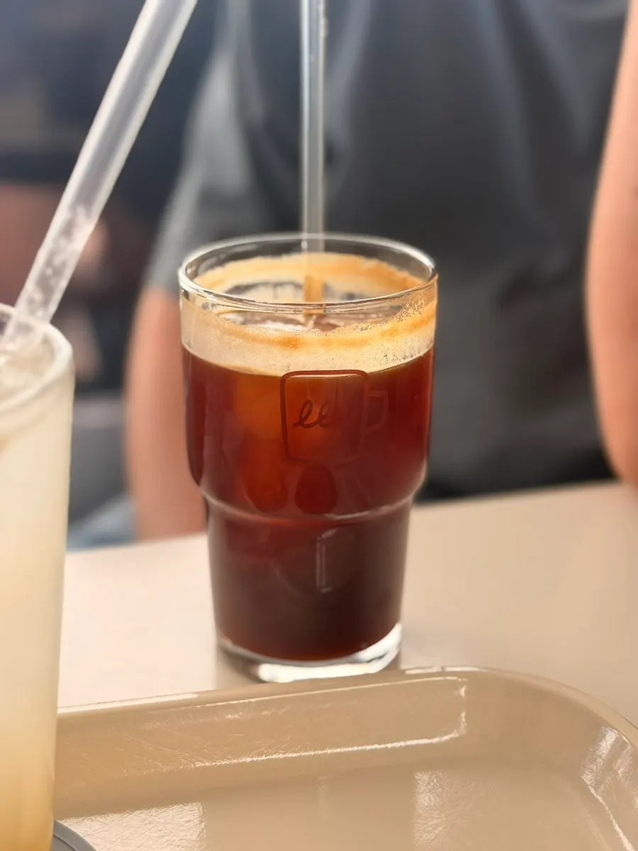 Glass of lemonade full of lemon syrup