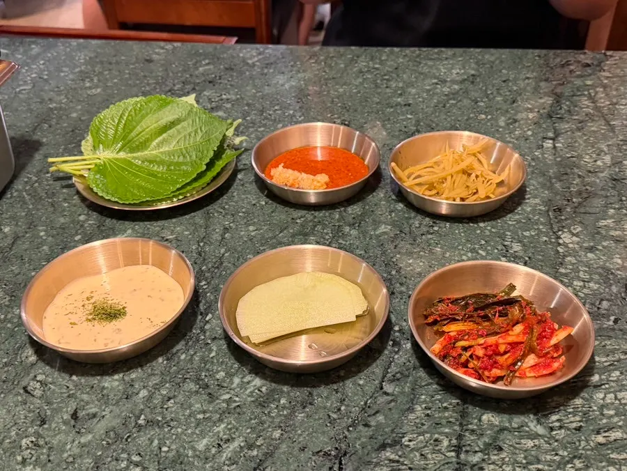 Full spread of banchan (side dishes) at Gongjung Dodeok
