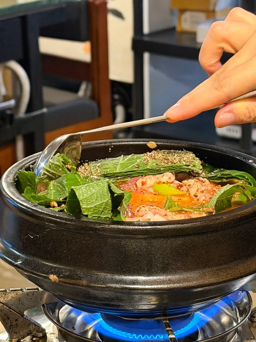 Gongjung Dodeok's duck gamjatang, gonggamtang, on the burner