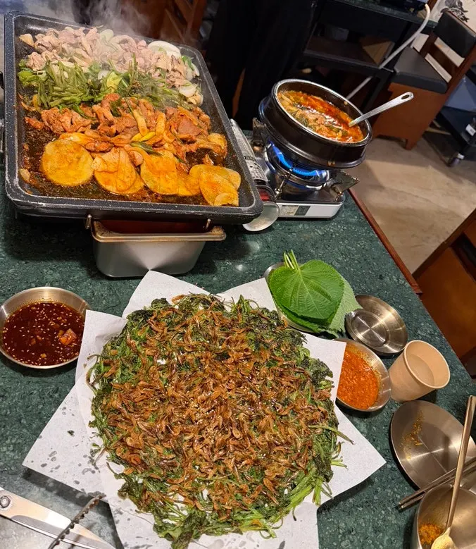 Gongjung Dodeok table full of food