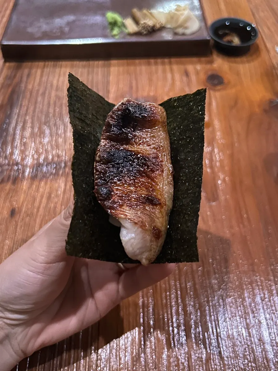 Grilled nodoguro sushi wrapped in seaweed