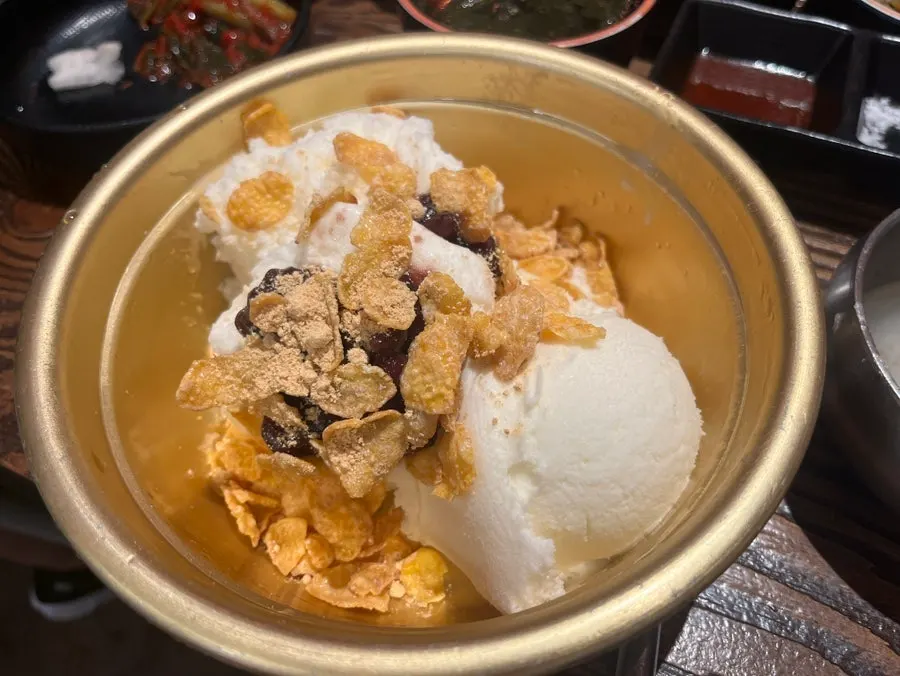 Bucket ice cream topped with red bean and injeolmi powder