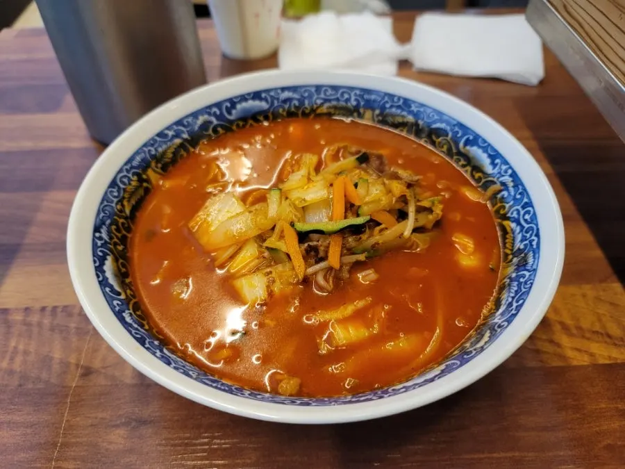 Beef brisket jjamppong rice with rice served in a separate bowl