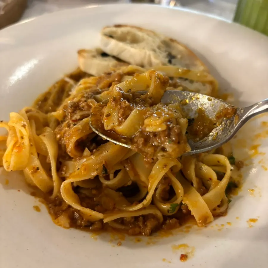 Eating the bolognese ragu pasta