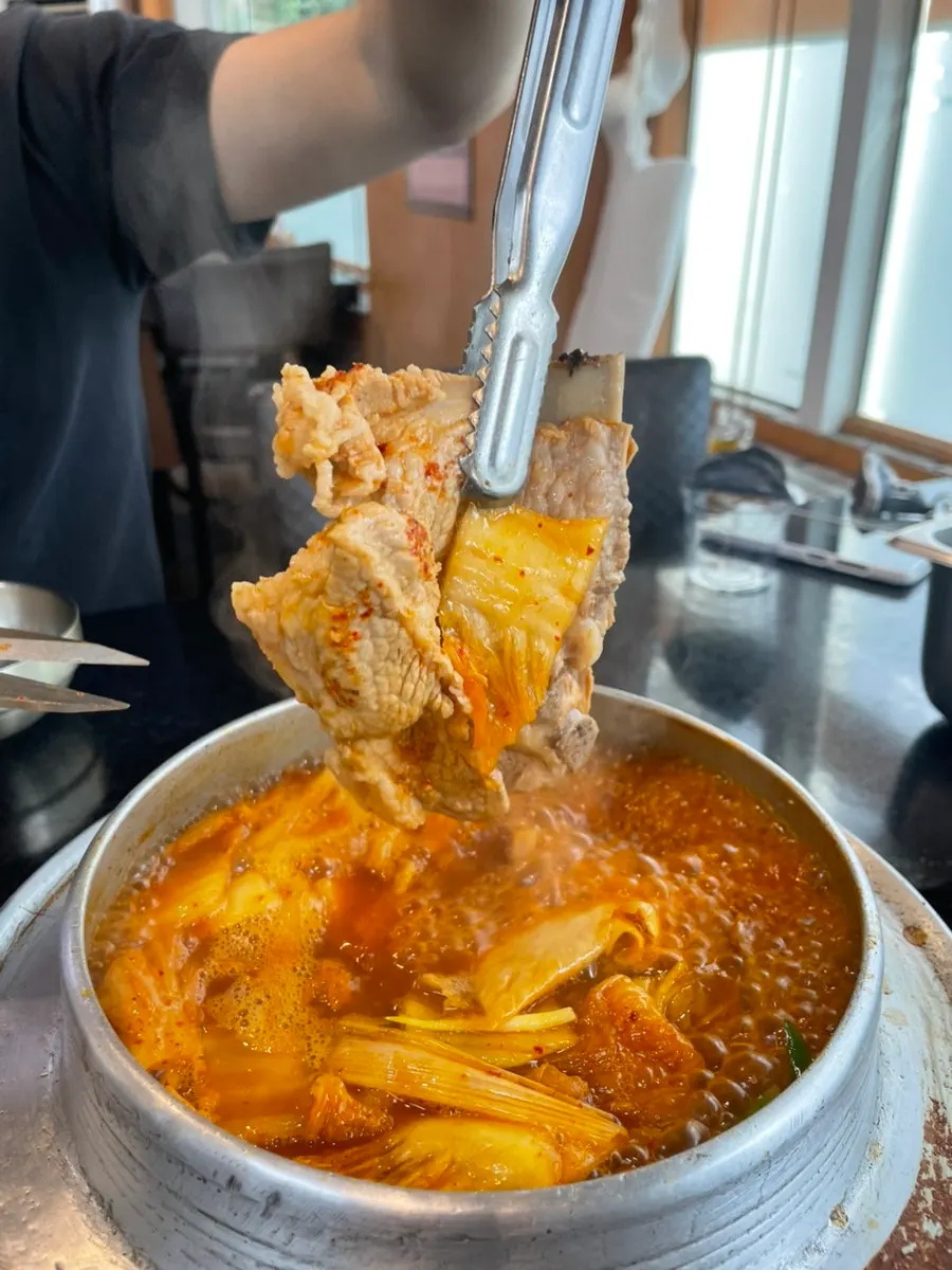 Kimchi stew simmering with added tofu