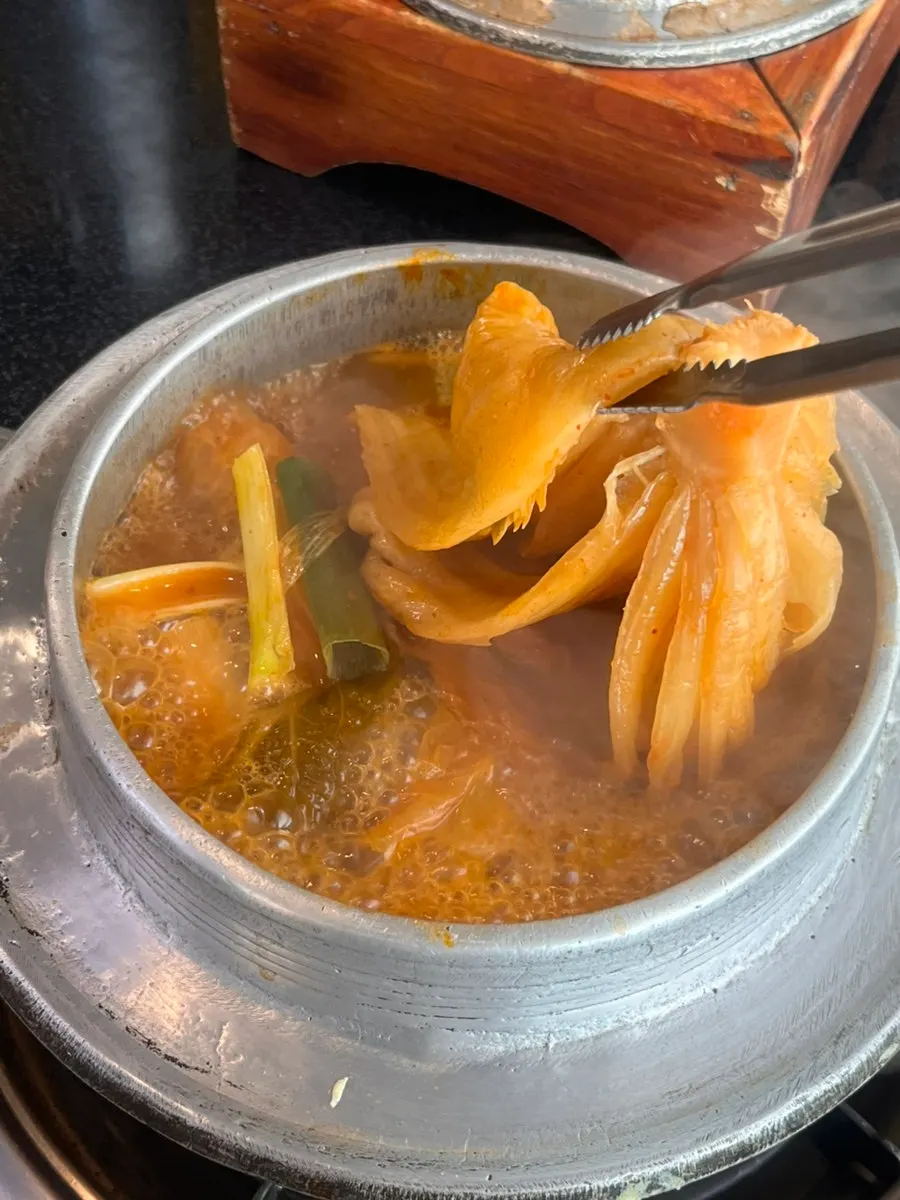 Well-simmered kimchi stew broth with whole kimchi