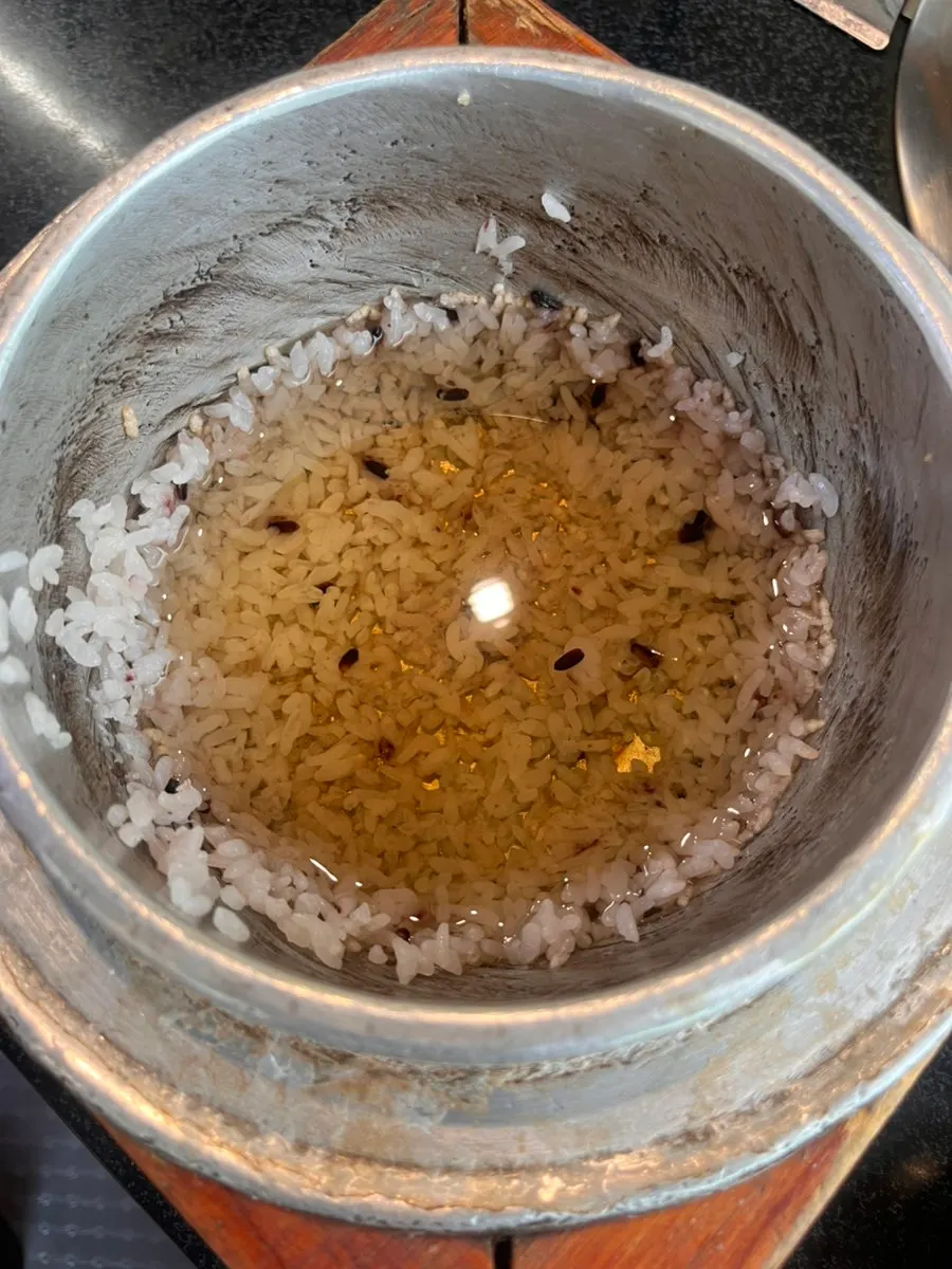 Stone pot rice with rice scooped out