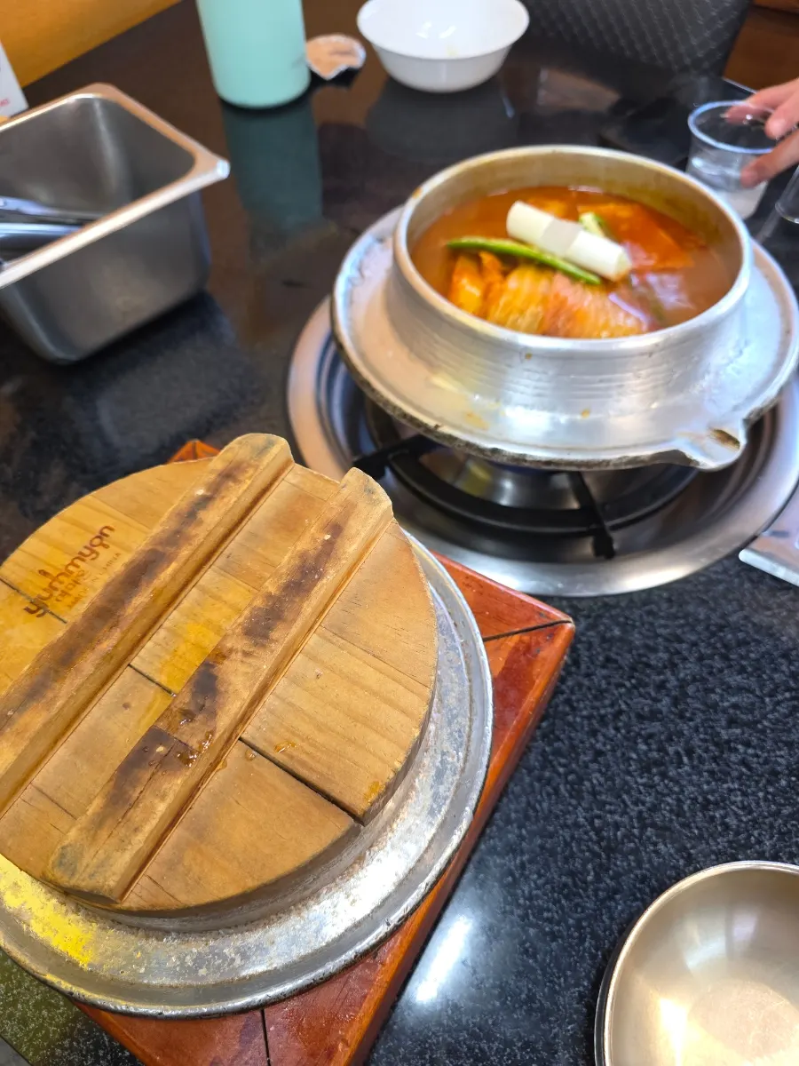 Galbi kimchi jjigae and a large pot of rice