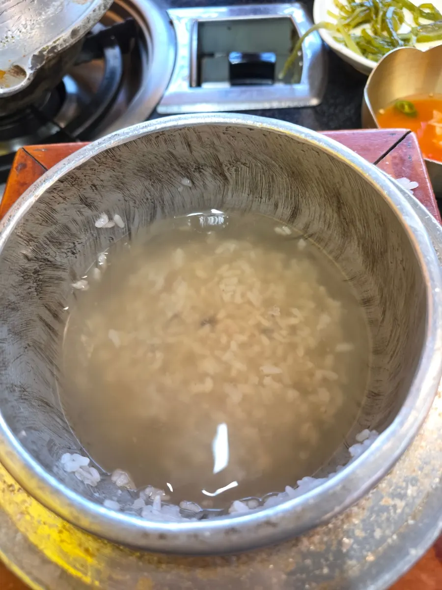 Ramyeon noodles added to and cooked in kimchi jjigae