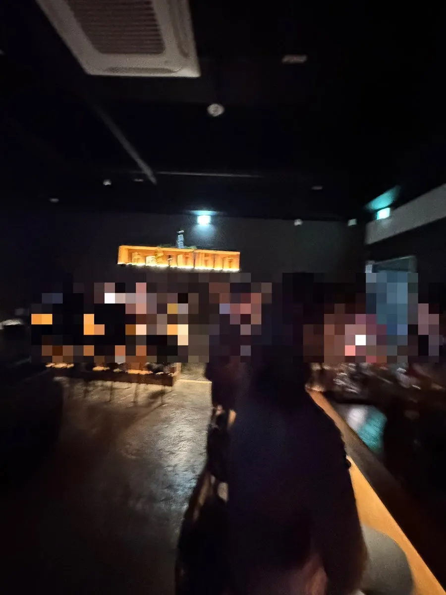 Interior of a Bongmyeong-dong solo-drinking bar with floor-to-ceiling windows