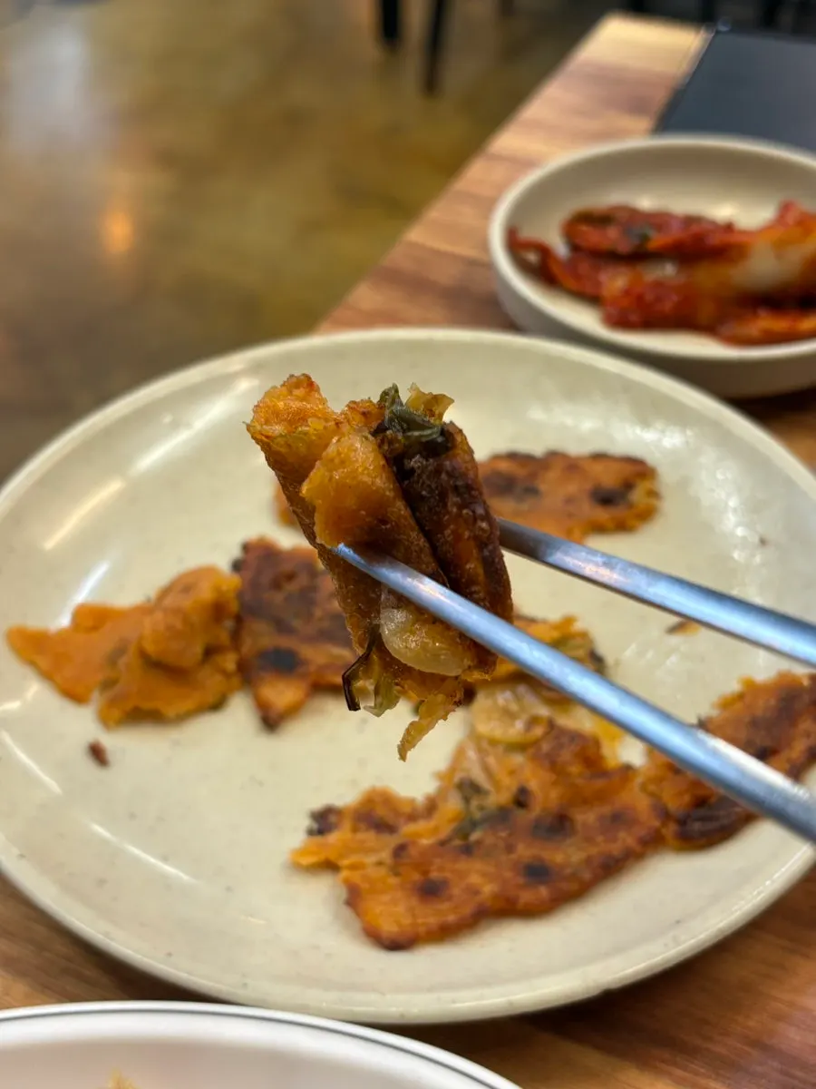 Silkworm pupae and fried spring rolls as banchan