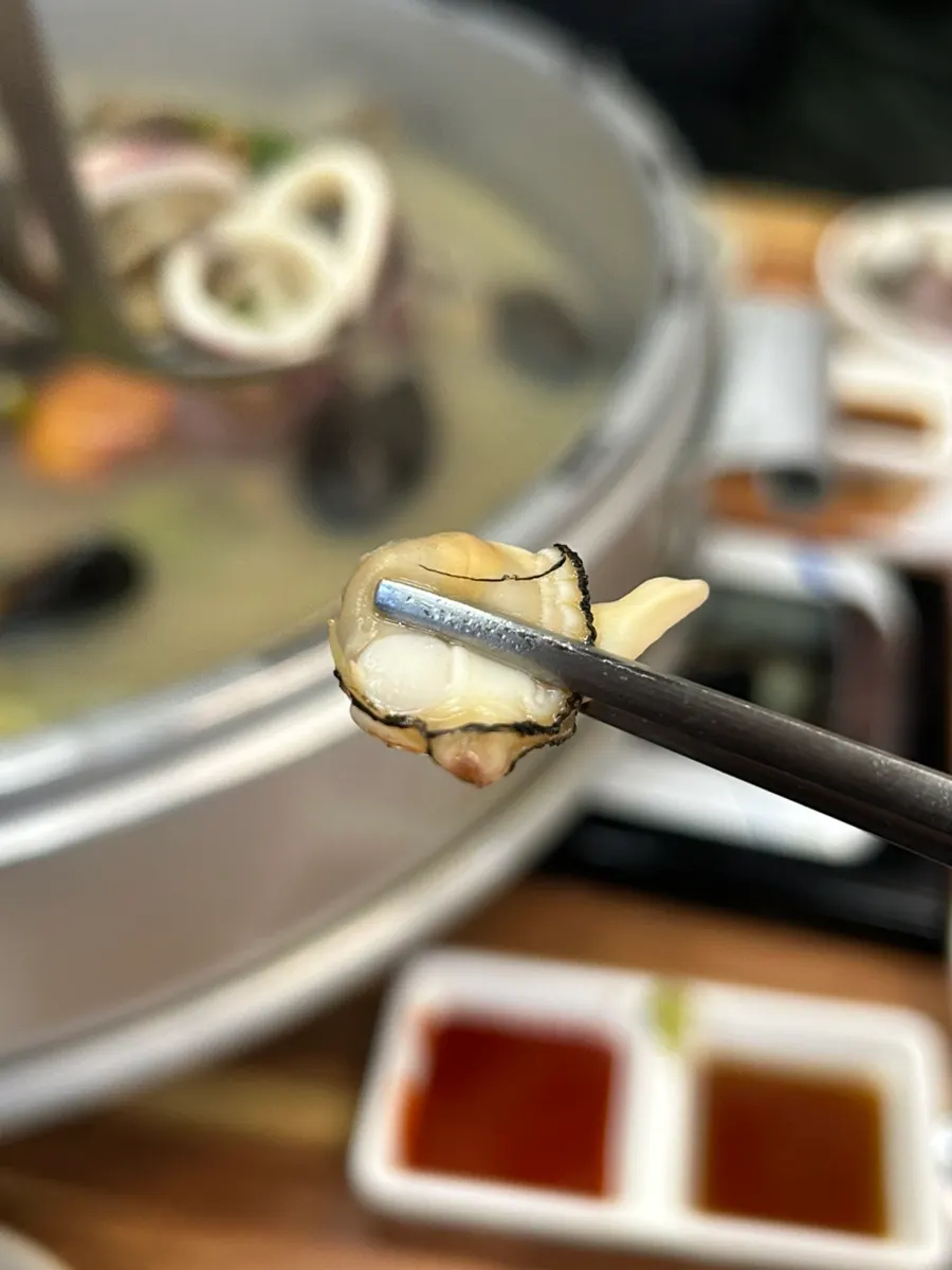 Clam hot pot broth simmering