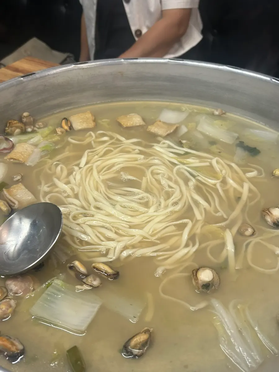 Kalguksu noodles simmered in the clam broth