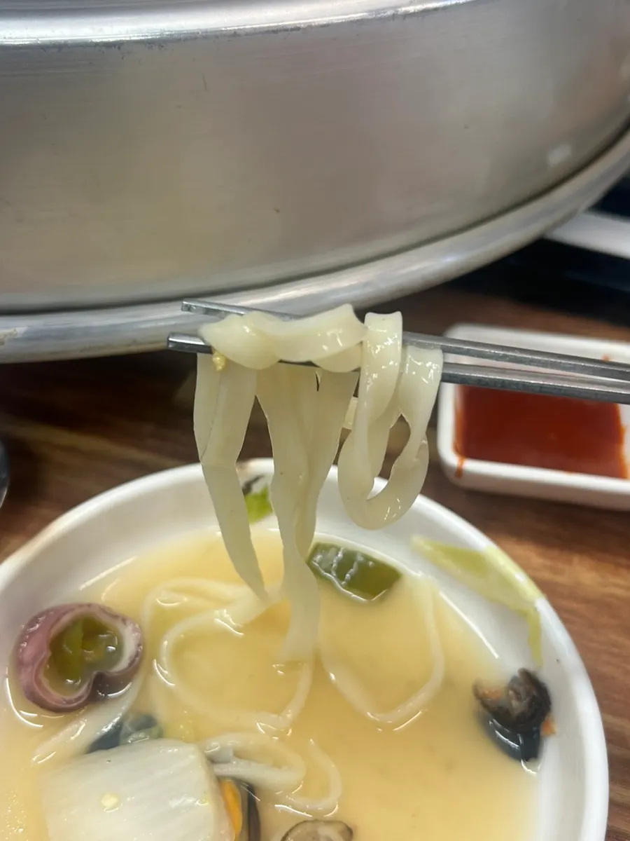 Chewy kalguksu noodles soaked in broth