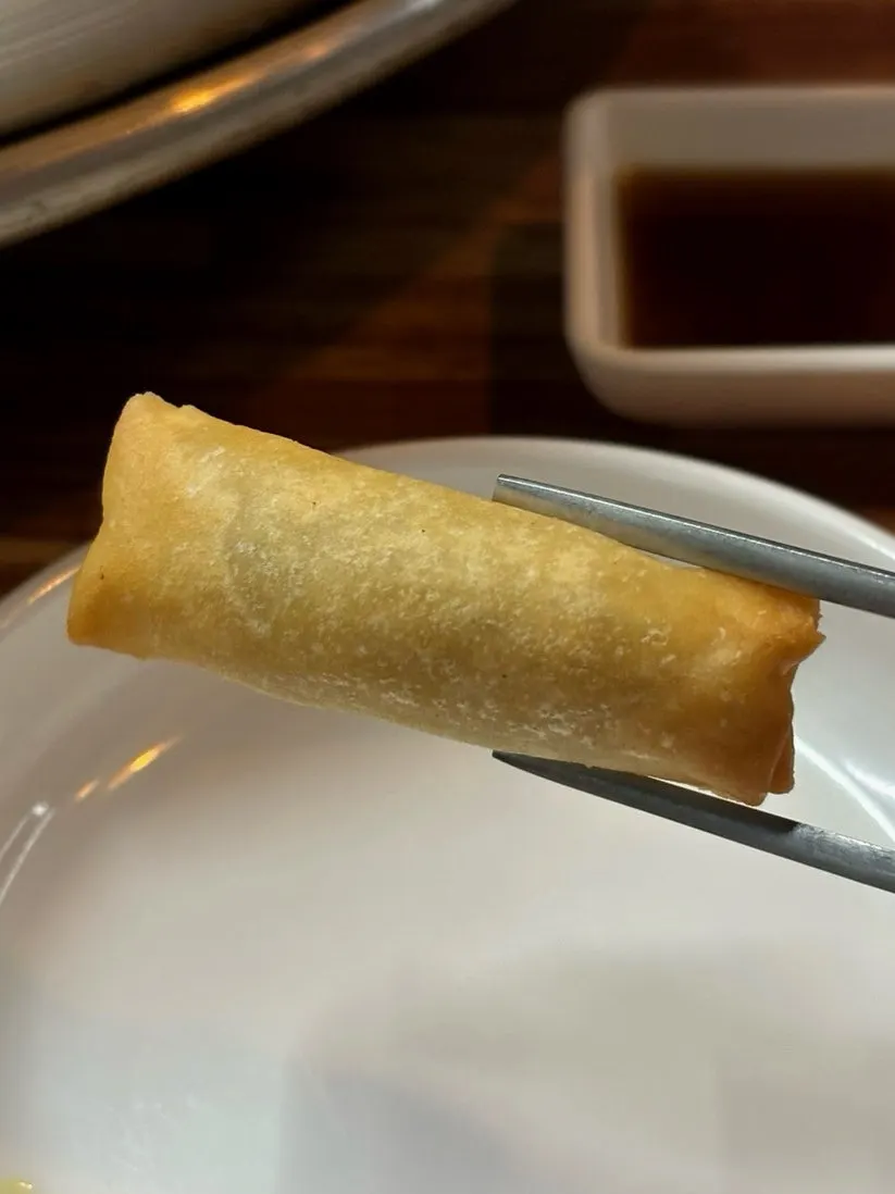 Complimentary spring rolls and fried squid