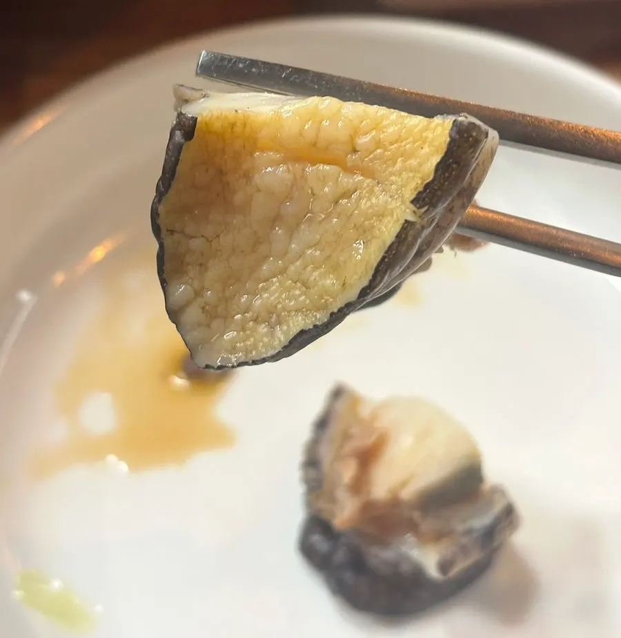 Staff-trimmed moon scallop and whole squid