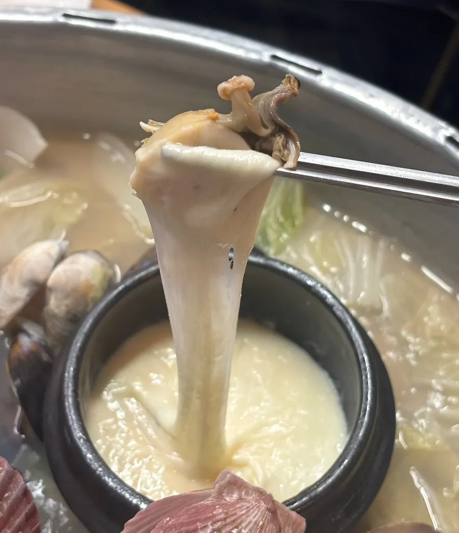Stretchy cheese from the stone pot inside the hotpot